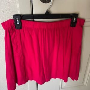 Hot pink short skirt with pockets.